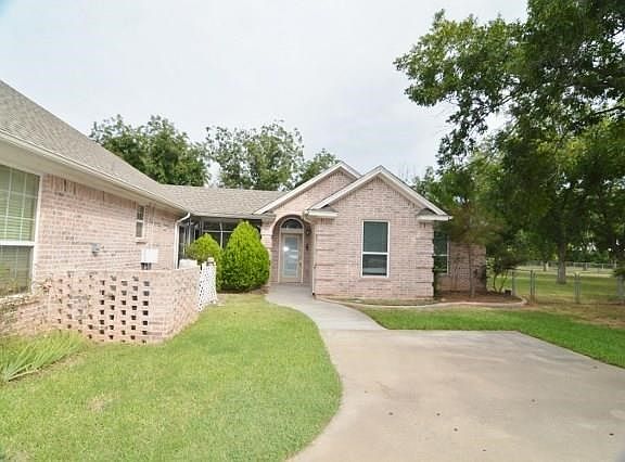 GUEST HOUSE CONNECTS TO HOME ON A LONG GLASS ENCLOSED HEATED & COOLED BREEZEWAY.