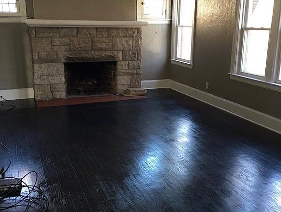 Large Living Room with Natural Fireplace and Beautiful Hardwood Floors.