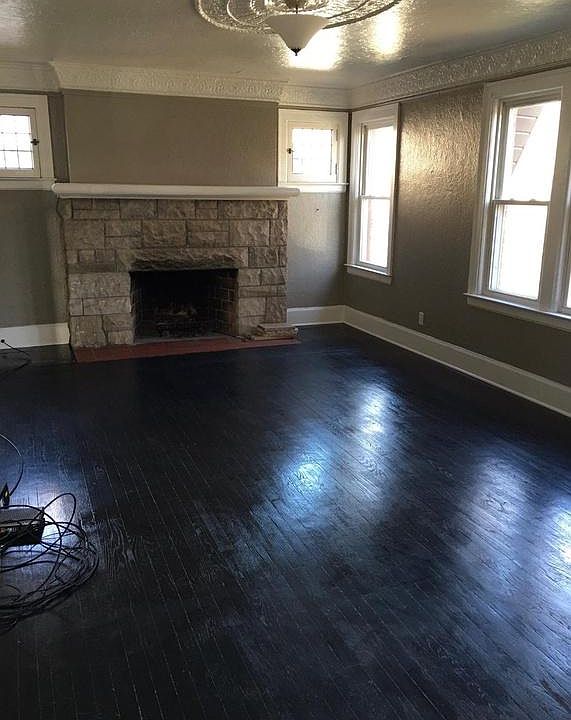 Large Living Room with Natural Fireplace and Beautiful Hardwood Floors.