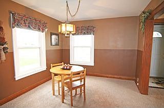 Formal dinning room in neutral tan colors.