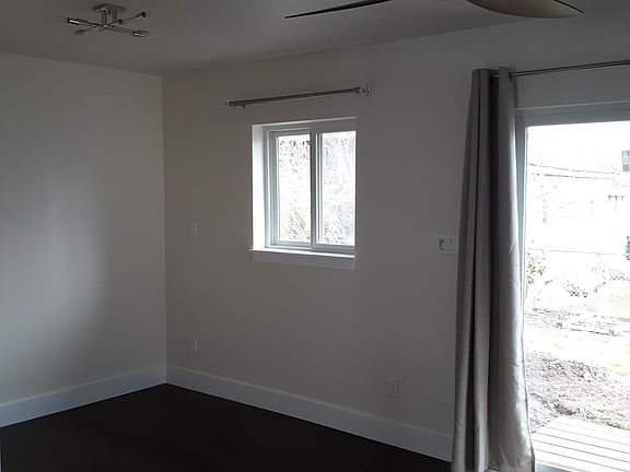 bedroom area, slider allows you to see all the way through the studio
