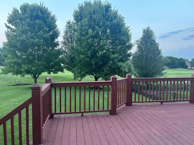 Spacious Deck through door to he family room looking onto the serene backyard and golf course.