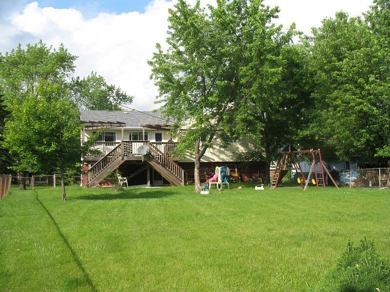 Enjoy custom deck & Backyard complete with Playground