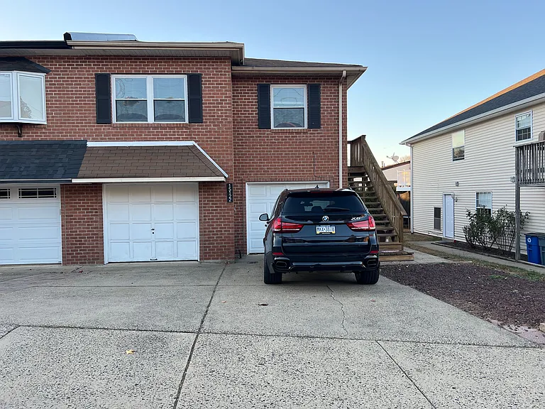 Front of Home - Left Garage is Unit #1 and 2 Spaces in Front. Access to unit through garage or side door on right.