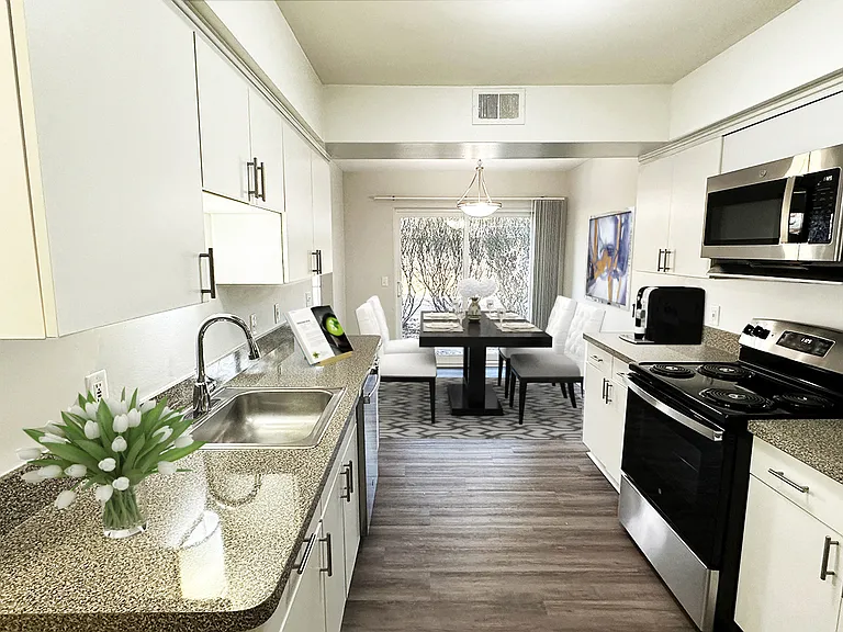 Large, full-featured kitchen with white modern cabinetry