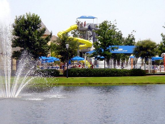 Neighborhood has awesome waterpark, ponds, lakes, golf, and tennis!