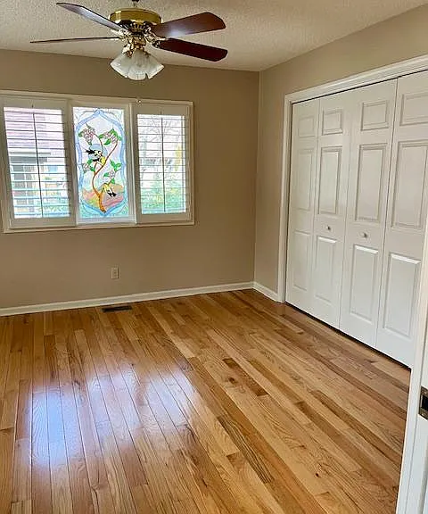 Den/bedroom located off kitchen has pocket doors for privacy.