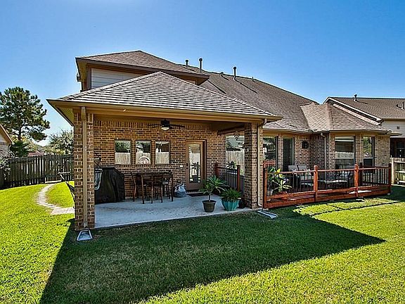 Spacious Back Yard With Covered Patio Area & Charming Deck Area For More Entertaining. Look How Large The Side Yard Is With Walk Way To The Gate.