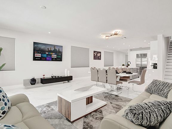 The home features a bright, open concept living with chic, contemporary design