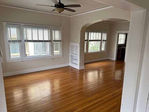 Living room and dining room viewed from front glass patio door.