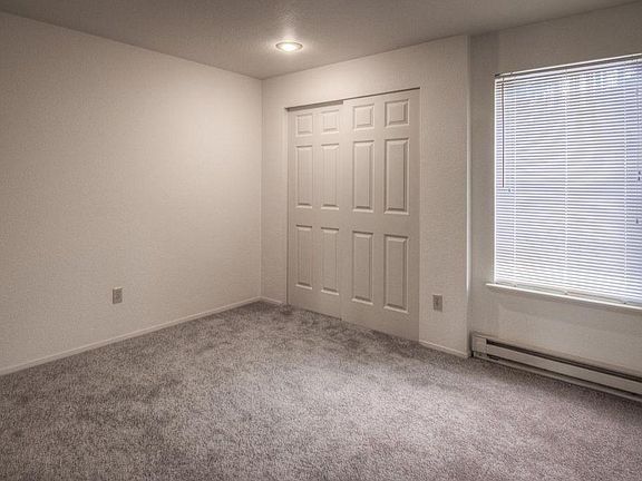 Newly installed carpet and closet doors in bedrooms