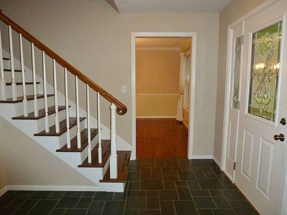 This wonderful foyer has slate tile floors!