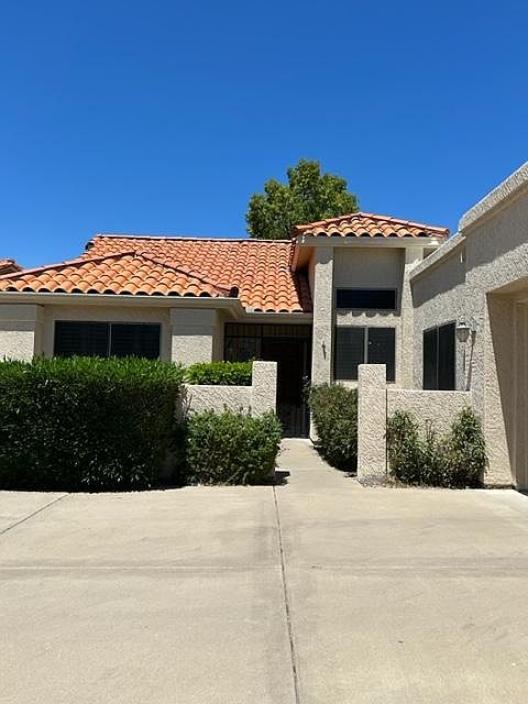 Exterior with new roof. Ample driveway space.
