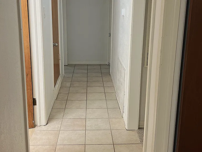 Hallway - bathroom left, entrance hallway/living room mid-left, kitchen mid-right, bedroom #2 right, master bedroom bottom right