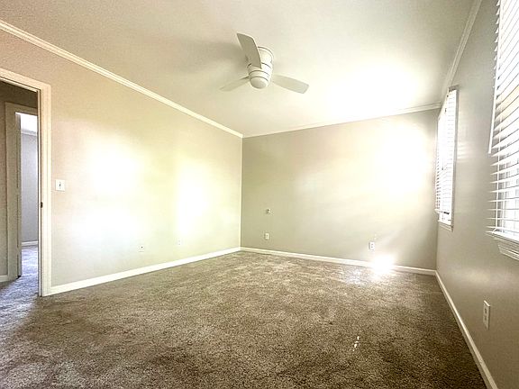 Upstairs bedroom with east facing windows, large walk-in closet, new carpet and ceiling fan