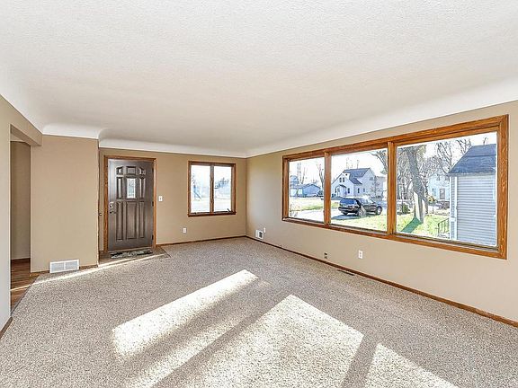 A wall of windows creates bright and open living spaces.