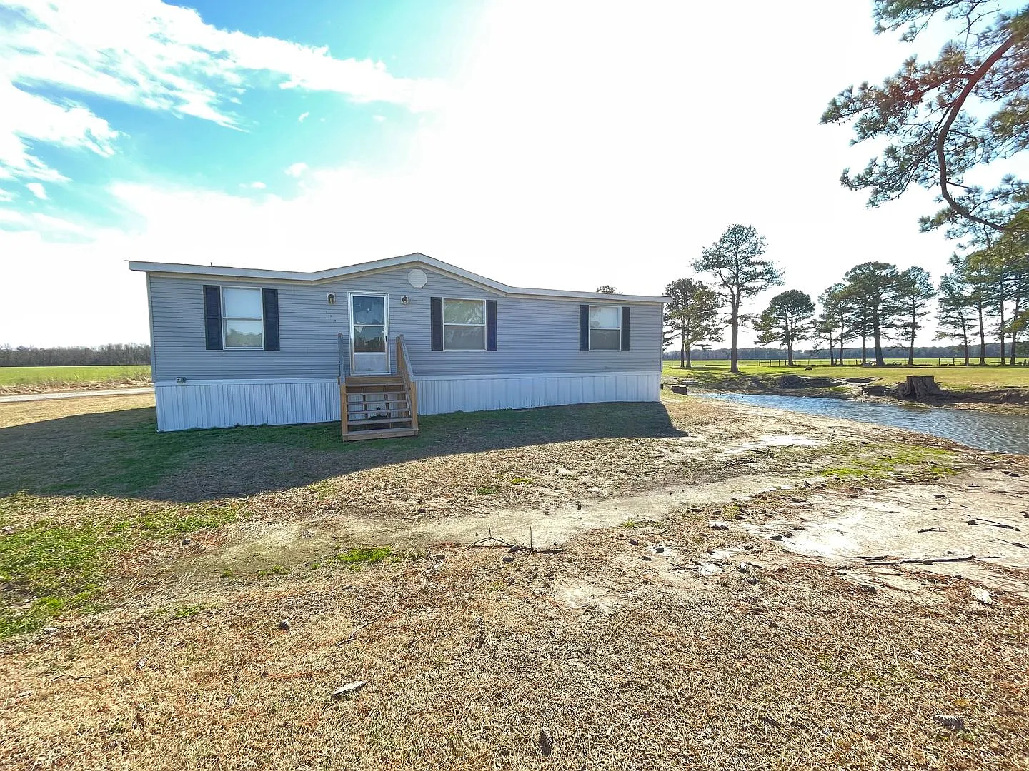 County Quiet Setting- Doublewide- Split Floor Plan with Deck- Grass, Water, Sewer included — Photo 1