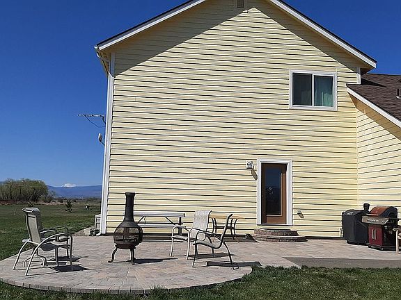 Paver patio with house as windblock