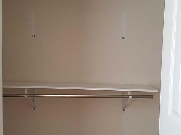 Bedroom closet with 2 shelves