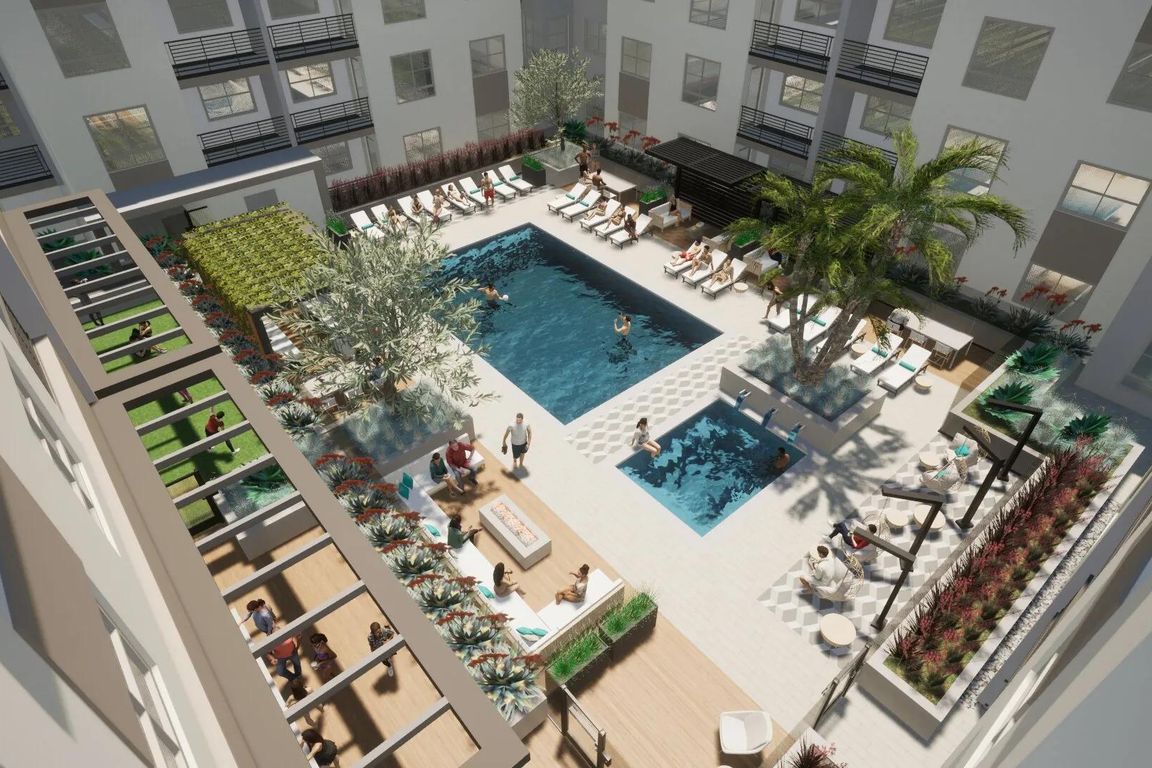 A dynamic courtyard with resort-inspired pool, layered seating, and inviting spaces to relax or connect.