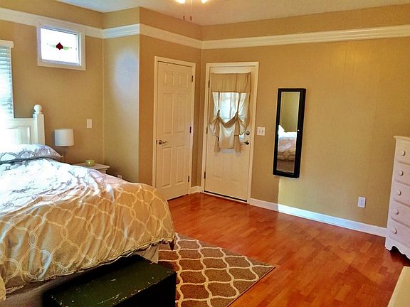 Master Bedroom : This room is an oasis with a 9ft ceiling, natural lighting, & exposed brick!