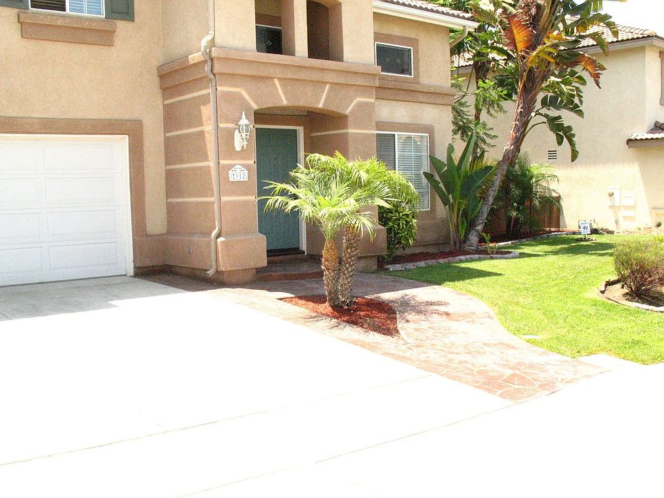 stamped concrete and landscaped yard