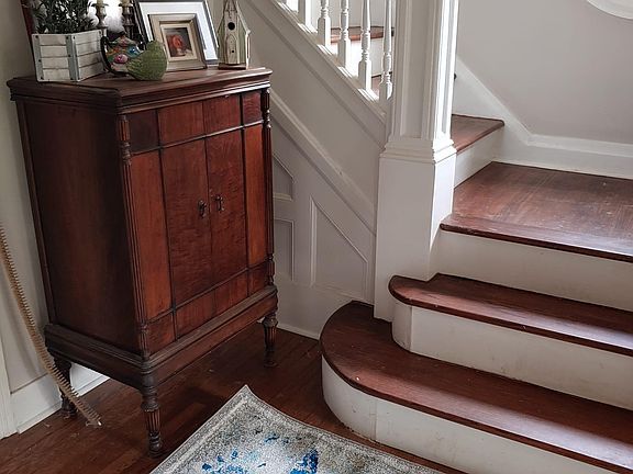 Beautiful double staircase with hardwood