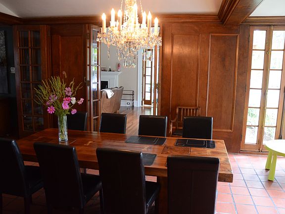 Dining room leads to living room and deck