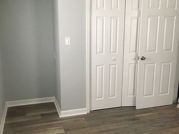 Bedroom with closet and desk study nook with overhead lightening