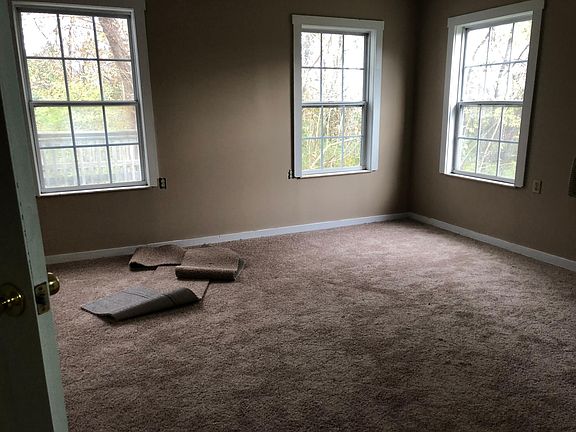 Master bedroom with 3 woods facing windows