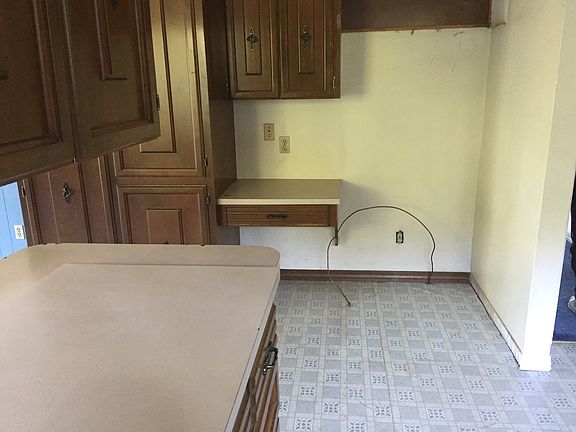 phone desek in kitchen next to fridge slot