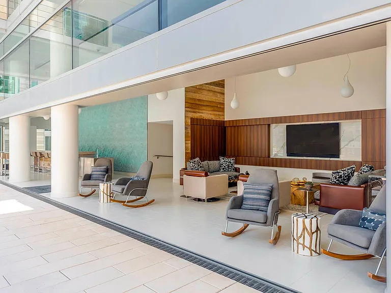 Relax in style in this sophisticated lounge space, where modern comforts meet open-air living and entertainment.