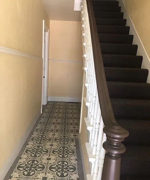 Stairway and historic tile in Entry