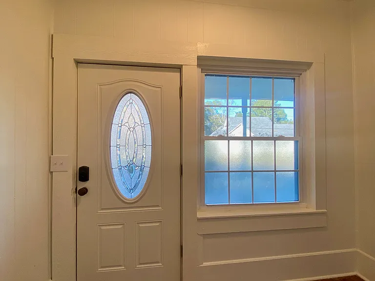 Front Door entrance and foyer - exits to the front porch