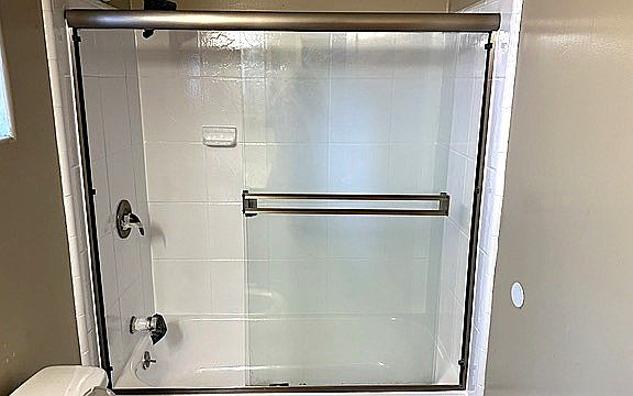 Freshened bathrooms with his and hers