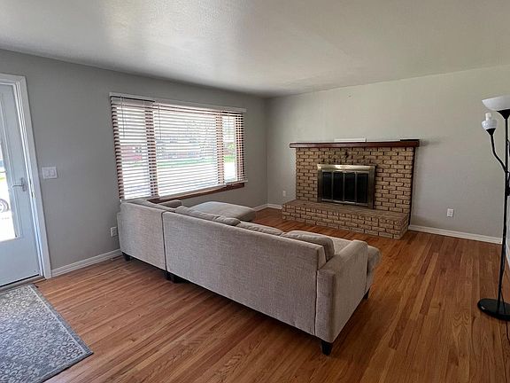 Entry and LivingRoom with wood fireplace