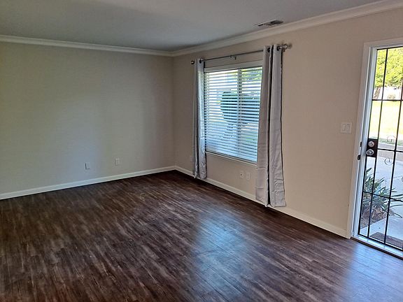 Living Room laminated flooring and crown molding.
