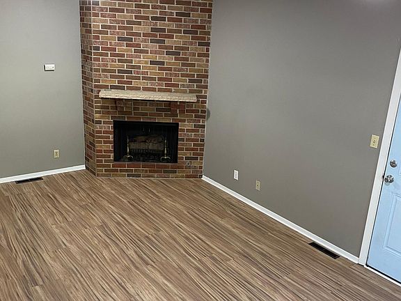 The gas fireplace in den area! The Den (20" X 11') is the first room off the garage. The blue door here leads to the garage!