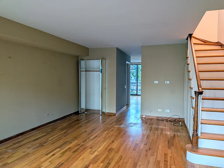 view from front of unit, looking at stairs, looking toward kitchen