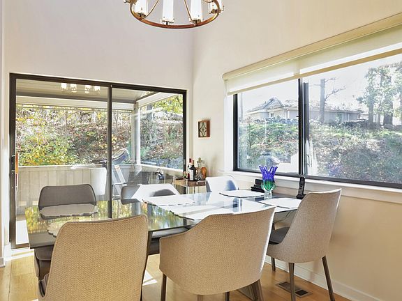 Spacious dining area with glass sliders to private patio