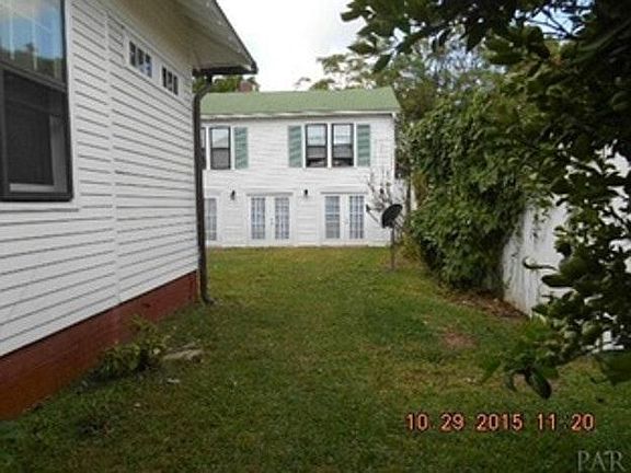 View from driveway, with main house on property to the left.