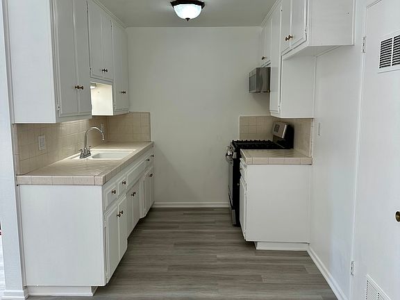 Roomy kitchen with lots of storage. Gas stove and microwave oven included.