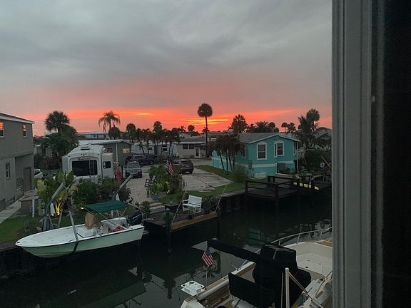 back of house view from the upper deck, the neighbors are all very nice people, beautiful sunsets every day on nettles isle.