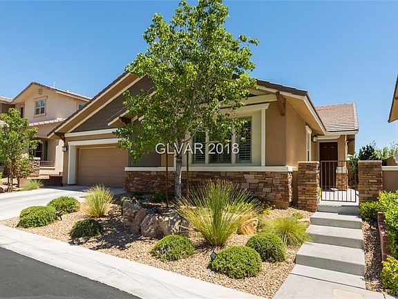 Exterior Front with Courtyard Entry Patio
