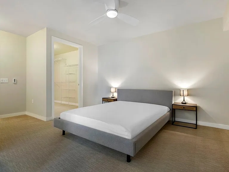 Furnished+ apartment homes feature queen bed with mattress, dresser, nightstands, and lamps (Representative Image exact items and style of furnishings may vary)