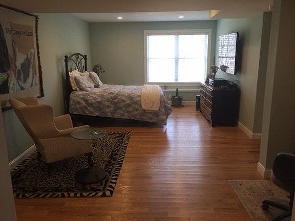 Bedroom has walk in closet also 60 inch Samsung wall mounted