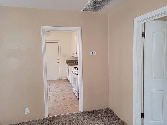 Living room with view to kitchen