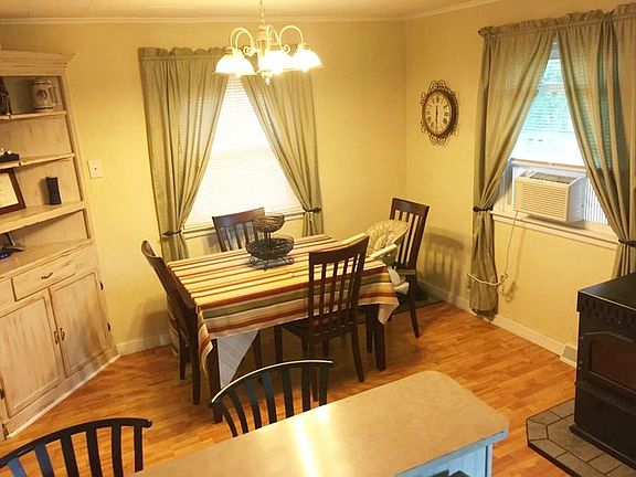 The dining room is just off the kitchen. I carries on the laminate flooring tying the two rooms toge