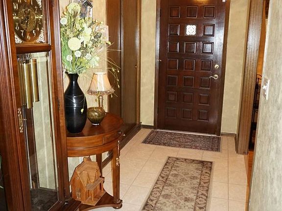 Foyer has a deep walk in lighted closet.