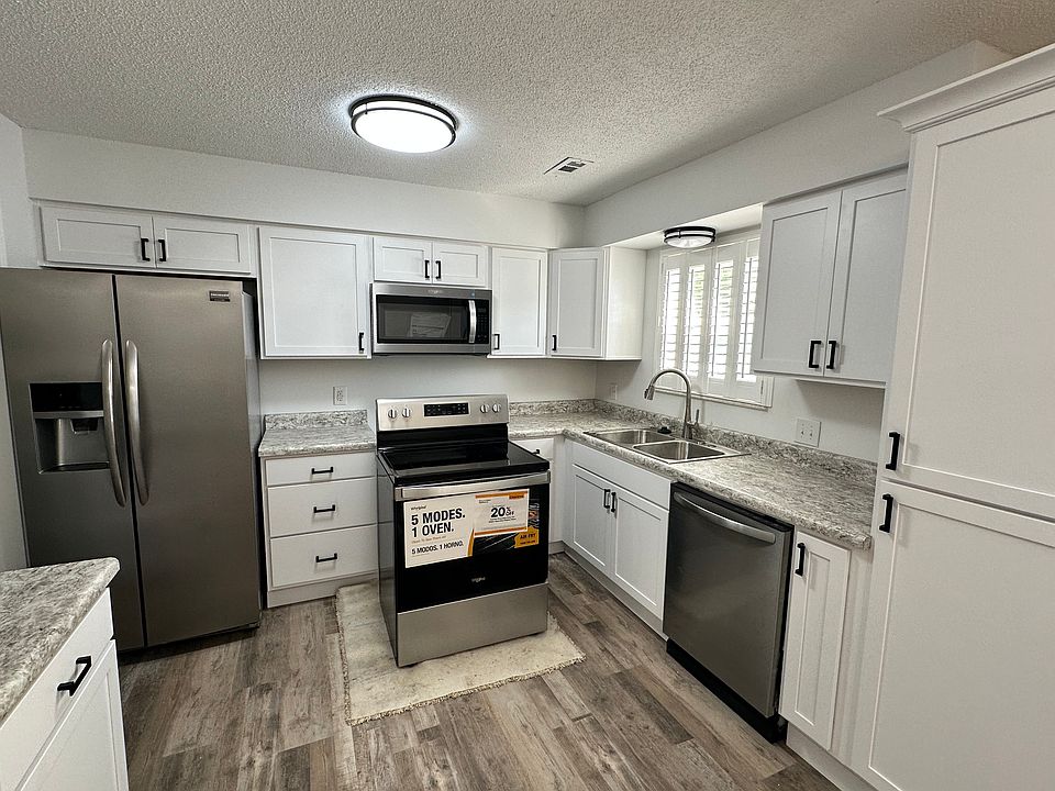 Updated kitchen with new cabinets, new appliances, new fixtures.